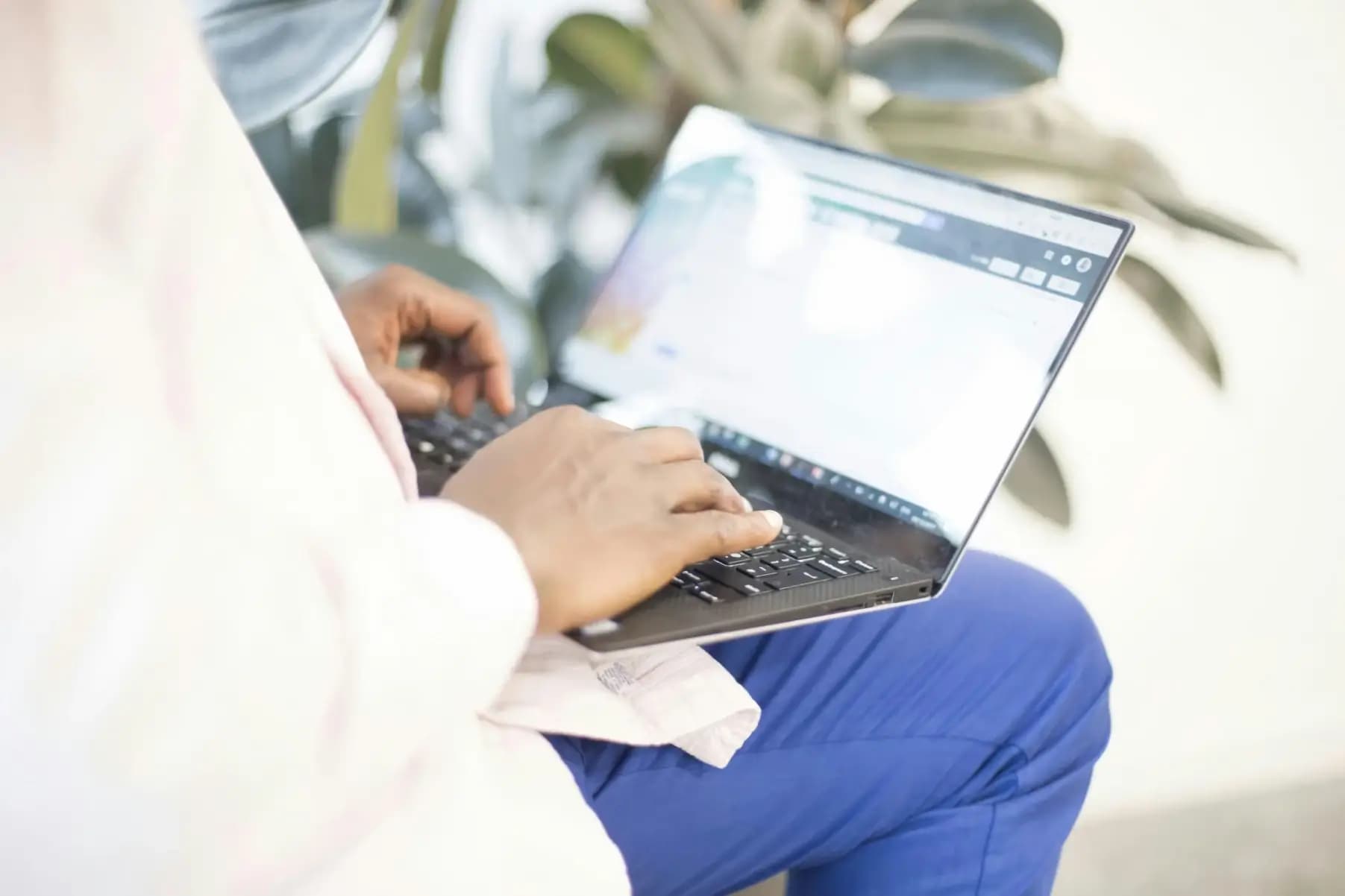 Nurse reviewing patient feedback on a laptop