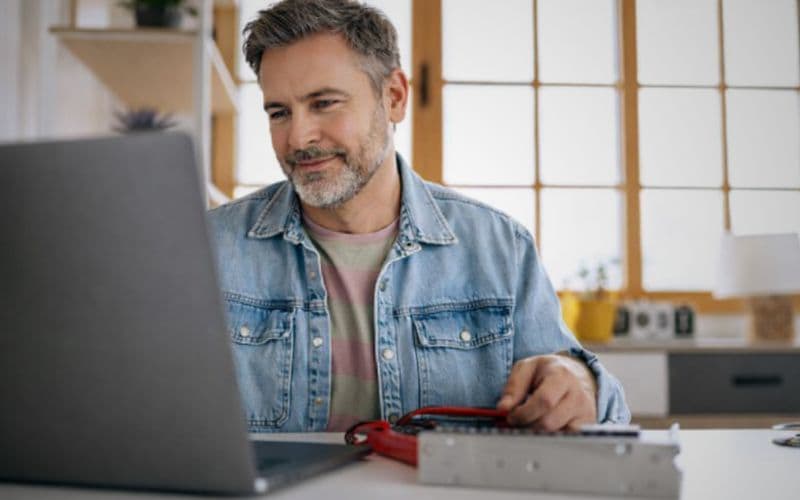 Recruiter reviewing a resume on screen while candidate edits content in ChatGPT, highlighting concerns around AI-generated resumes