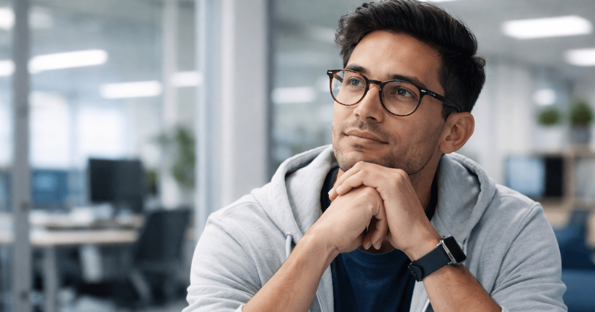 Person at a laptop reviewing and comparing free resume builder options, thoughtfully evaluating templates and content before finalizing a resume